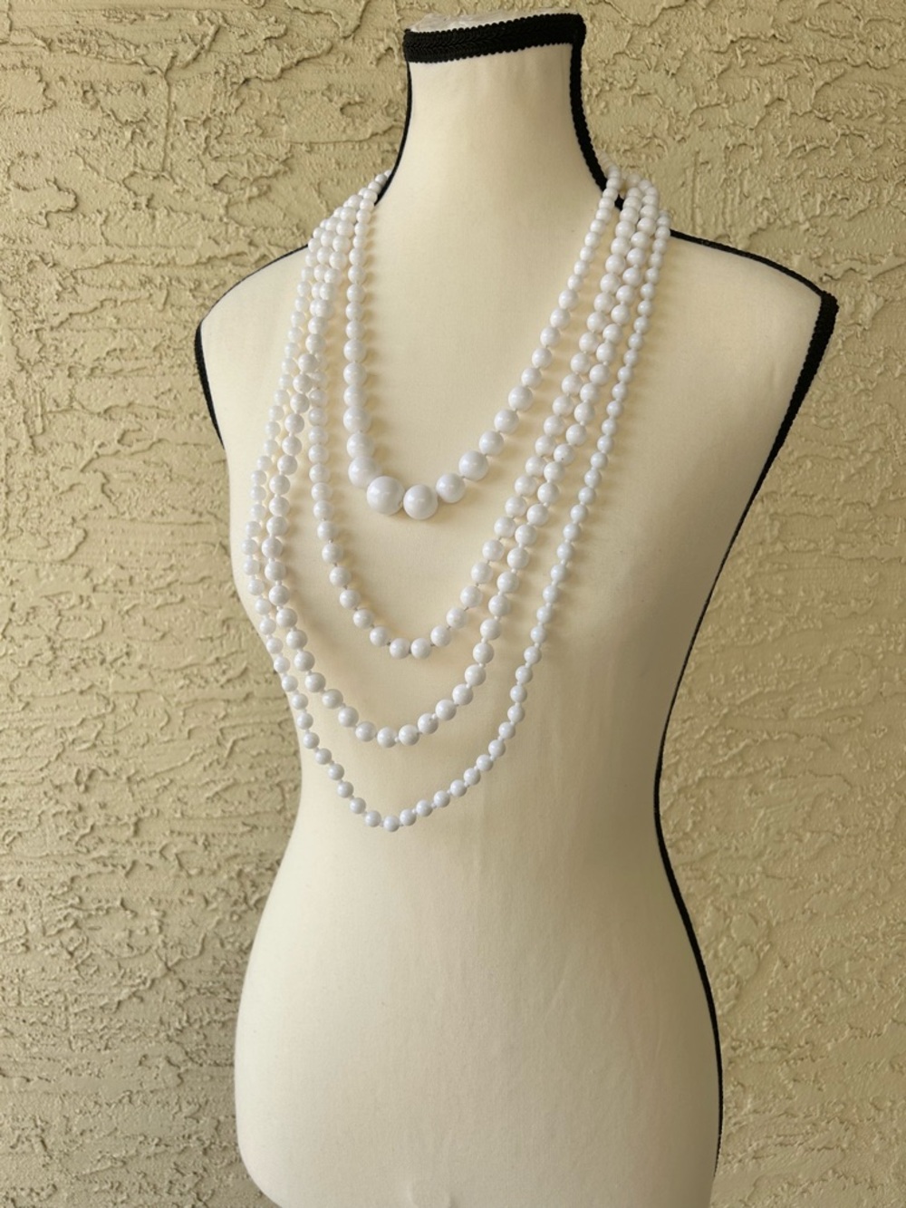 Vintage four pack of white plastic beaded necklaces